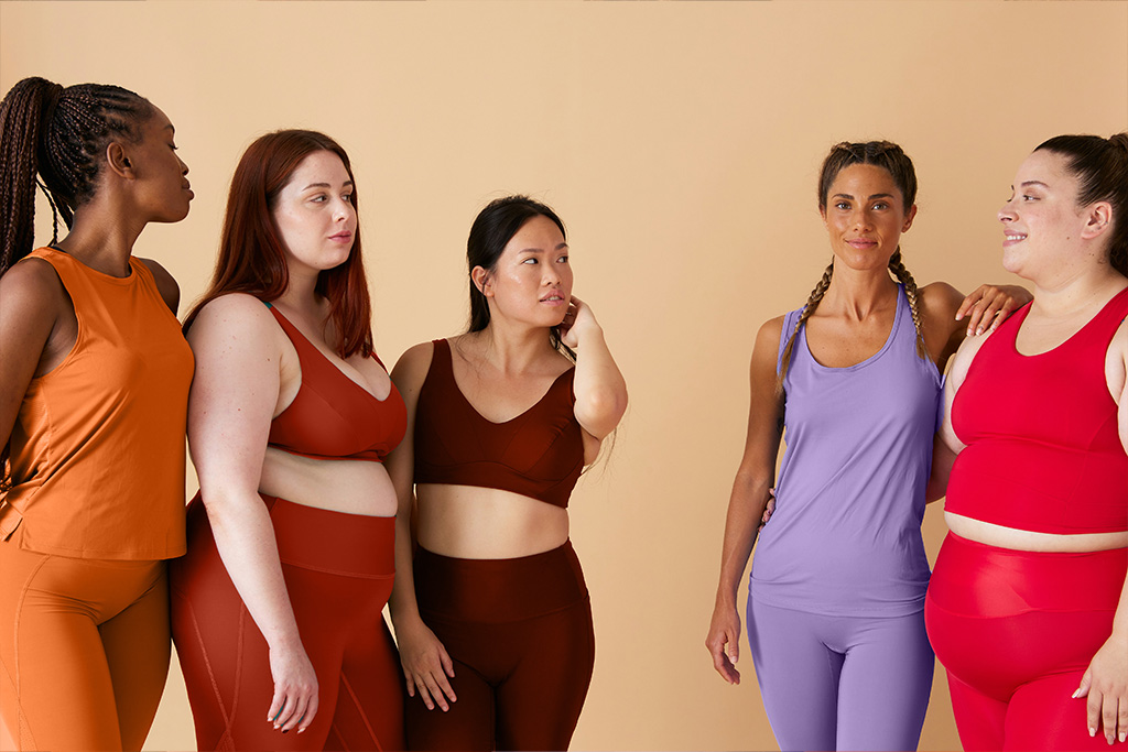 Women of different ages and body shapes standing together
